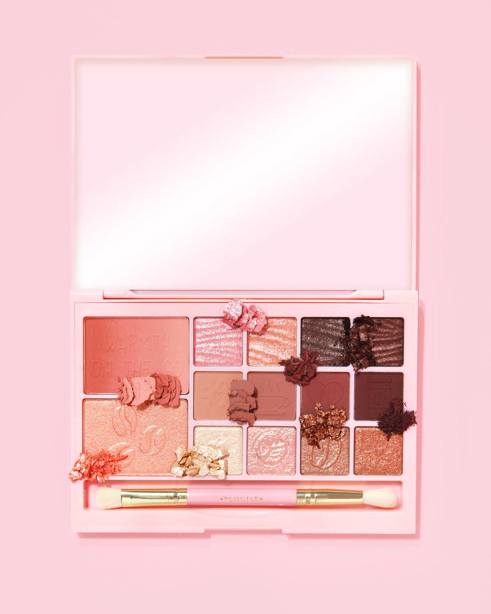 An image of the P. Louise Breakfast Bites All In One Makeup Palette in Hot To Go in a neutral & mauve colour way on a pink background