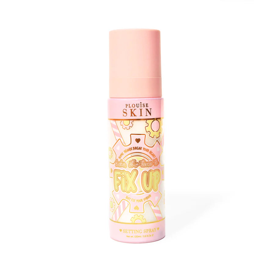 Pink bottle of P. Louise Fix Up Mattifying Setting Spray with pink and yellow gear design on the bottle against a white background