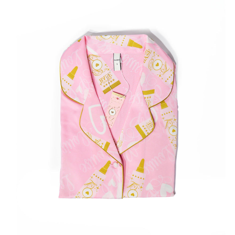 Roze P.Louise kinderpyjama met een gouden P.Louise-basisthema