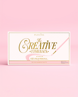 De voorkant van een gesloten P.Louise Creative COMeback XXXL Rainbow Eyeshadow Palette met gouden typografie op een roze hoesje tegen een roze achtergrond