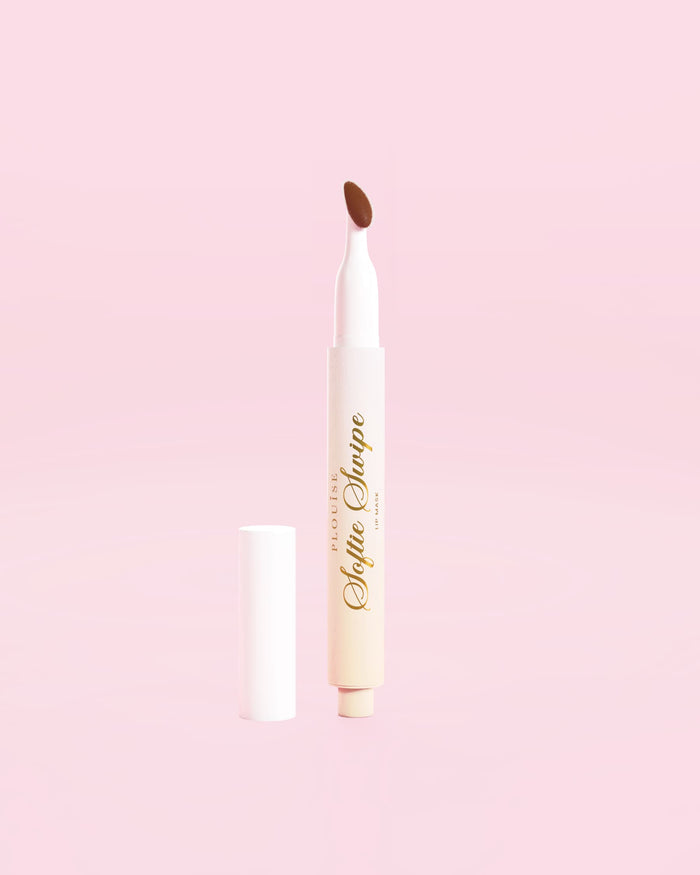 An image of a P.Louise Softie Swipe Tinted Lip Mask in Sweet Spot against a pink background
