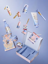 P.Louise Obsessed For Bad Bitch Blueberry products floating on a blue background