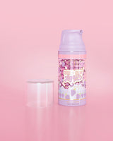 Purple bottle of P. Louise Here I Glow Again Grape Recovery Mask on a pink background